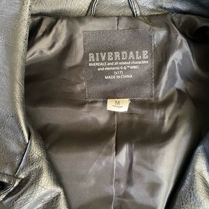 Black pleather jacket, edgy decal on back. Excellent condition. Size Medium.